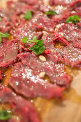 A close-up view of the ready-made carpaccio meat for tasting