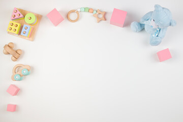 Baby kids toys frame on white background. Top view. Flat lay. Copy space for text