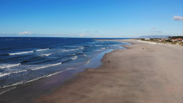 DRONE AERIAL FOOTAGE: The Ofir Beach. South of the mouth of the River C&aacute;vado, integrated in the Natural Park of the North Coast, the beach of Ofir surrounded by pine forests and dune vegetation.