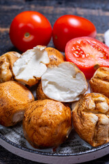 Tasty Italian food, small balls of smoked mozzarella soft cheese