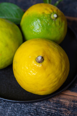 Fresh ripe bergamot orange fruits, fragrant citrus used in earl grey tea, medicine and spa treatments