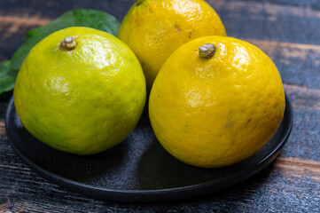 Fresh ripe bergamot orange fruits, fragrant citrus used in earl grey tea, medicine and spa treatments