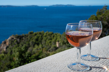 Picnic with of local rose wine and blue Mediterranean sea on background, near Saint-Tropez, Var, Provence, France