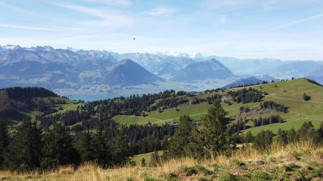 Panoramic view along hiking trail around Rigi-Kulm from Rigi-First the station of highest peak on Mount Rigi over 13 lakes and peaks of the Swiss Alps. Canton of Lucerne, Central Switzerland.
