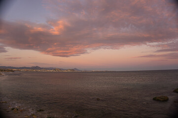 Beautiful and colorful sunset with cloud in the beach