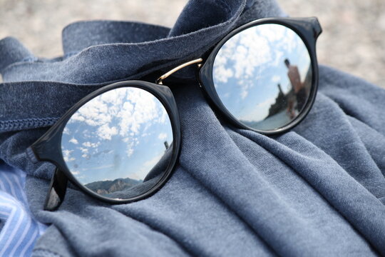 sunglasses and reflex of the sky