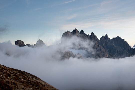 Dolomites mountain landscape rocky peaks above the clouds sunset. Dolomite Italy © Michalis Palis