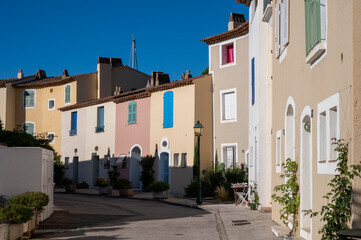 Fototapeta na wymiar Travel and vacation destination, view on houses, roofs, canals and boats in Port Grimaud, Var, Provence, French Riviera, France