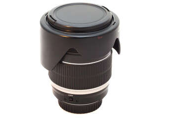 the lens with the lens hood from the SLR camera on white background