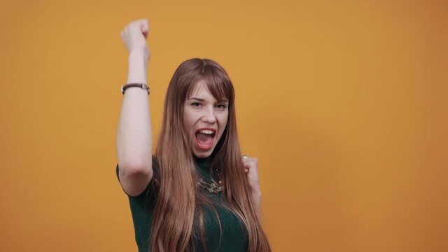 Excited young celebrating win, showing yes gesture, rejoicing success, reading good news, online lottery victory. Overjoyed crazy casual victorious event expressing emotions face isolated background