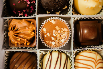 Assortment chocolate candies. Top view. Sweets dessert pattern. Confectionery concept 
