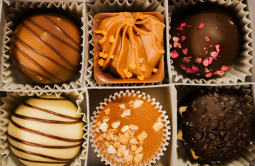 Assortment chocolate candies. Top view. Sweets dessert pattern. Confectionery concept 