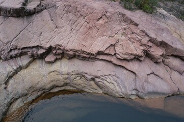 red rock bottom and river water