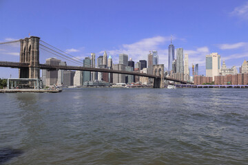 Fototapeta na wymiar View of Manhattan and Brooklyn Bridge from the Empire Fultom Ferry Park