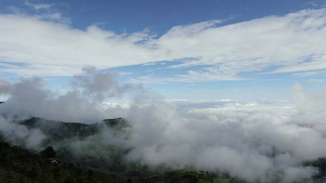 Aerial shot of mountains and clouds