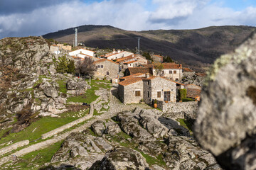 Obraz premium Photo of the village Trevejo in `Extremadura from the mountains. Historic Spanish village surrounded by nature during a sunny day.