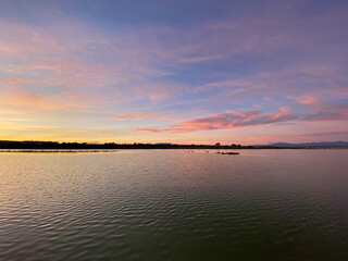 Beautiful and colorful sunset with cloud in the beach