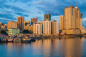 Fototapeta na wymiar Skyline of Manila behind Pasig river, Philippines.