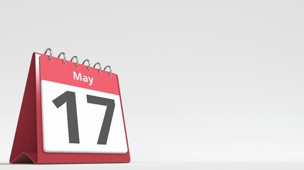 May 17 date on the flip desk calendar page, blank space for user text, 3d animation
