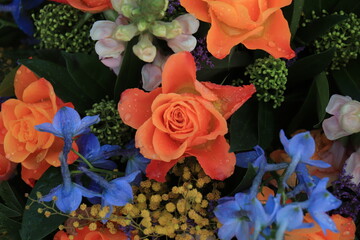 Orange and blue flower arrangement for a wedding
