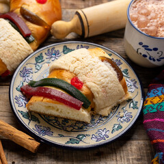 Kings day bread also called epiphany cake on wooden background