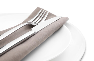 Plates with clean cutlery and napkin isolated on white