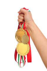 Woman holding gold medals on white background, closeup