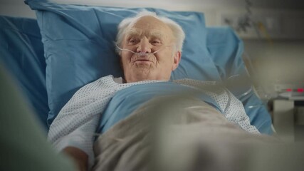 Hospital Ward: Portrait of Handsome Elderly Man Resting in Bed, Fully Recovering after Sickness and Successful Surgery. Old Man Smiling, Remembering His Happy Long Life, His Family and Friends