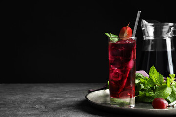 Delicious grape soda water with mint on grey table, space for text. Refreshing drink