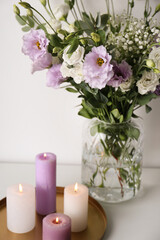 Obraz na płótnie Canvas Bouquet of beautiful Eustoma flowers on white table