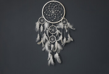 Beautiful dream catcher hanging on black wall - Powered by Adobe
