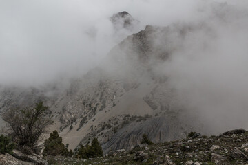 Rocks in mist in Fann mountains, Tajikistan