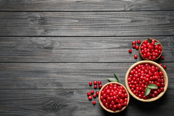Ripe fresh cranberry on grey wooden table, flat lay. Space for text
