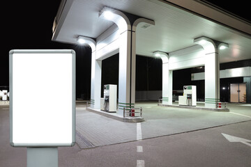Empty billboard on modern gas station outdoors, space for design