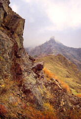 Rocks of the Altai mountains in the fog 
