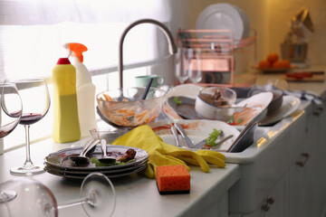 Dirty dishes in kitchen after new year party