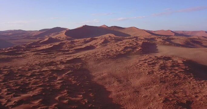4K aerial drone video of famous endless sand sea and Sossusvlei Namib Desert scenic red sand dunes on sunny afternoon in Namib-Naukluft Park in Namibia, southern Africa
