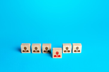 Person figurine comes out of the row. Promotion at work, appointment to the role of team leader. Dismissal of an employee. Take the first step, be different. Initiative and aspiration. Different one