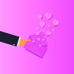 Hand hold mail sending pink heart love valentine day concept