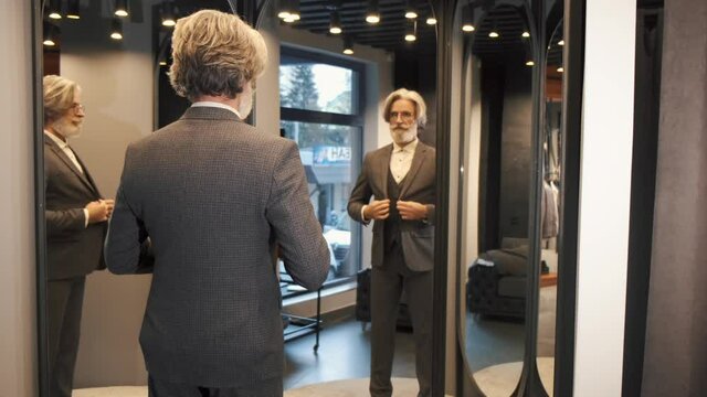 man inspecting suits and trying new outfits woman people business shopping young fashion couple person clothes shop beautiful clothing happy beauty office store casual blond smile portrait lifestyle