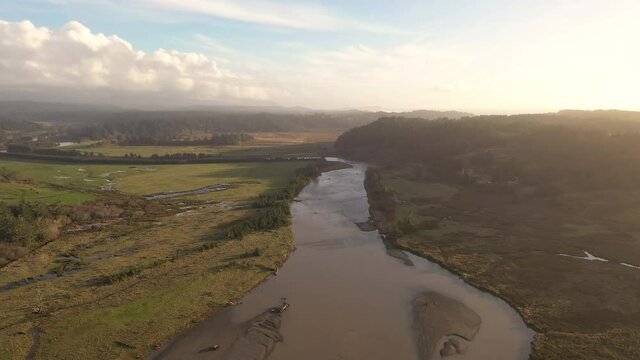 Aerial View Of Sixes River at Cape Blanco State Park With Hughes House In The Background In Oregon USA - Aerial Drone Shot