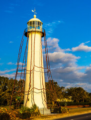64 feet high Historic Biloxi Lighthouse sits in the middle of US 90 highway and was built in 1848. Visitors Center is in rear