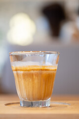 Dirty coffee. A glass of espresso shot mixed with cold fresh milk in coffee shop