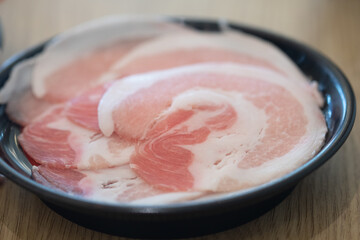 Thinly sliced of raw pork for Japanese hot pot.