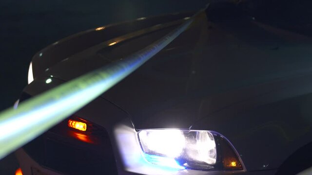 Police Tape Tied Around Polce Car with Siren Flashing 4K
