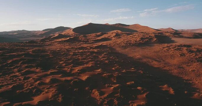 4K aerial drone video of famous endless sand sea and Sossusvlei Namib Desert scenic red sand dunes on sunny afternoon in Namib-Naukluft Park in Namibia, southern Africa