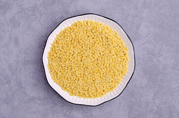 Fine dry pasta in a ceramic dish