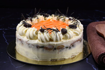 Classic carrot cake serving on the golden tray. Famous traditional baked dessert in party. 