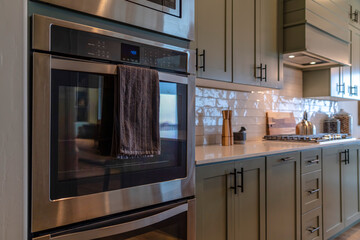 Interior of home with oven and cooking area inside the kitchen with cooktop