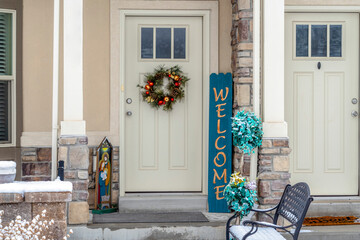 Christmas decorations at the entrance of an apartment with glass paned door